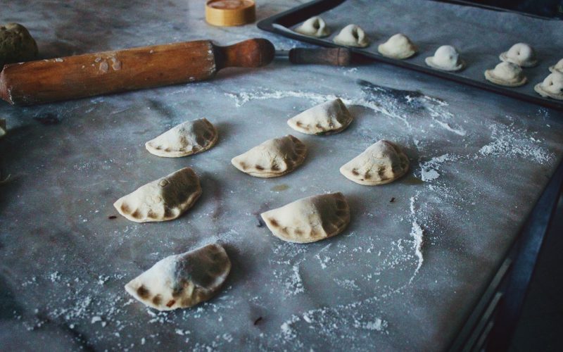 unbaked empanada on tray